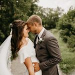 Wedding couple with forehead pressed up against each other