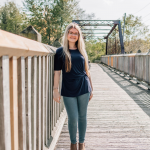 Katelyn standing on bridge