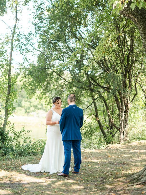 Bride and Groom reading their vows privately in a forest