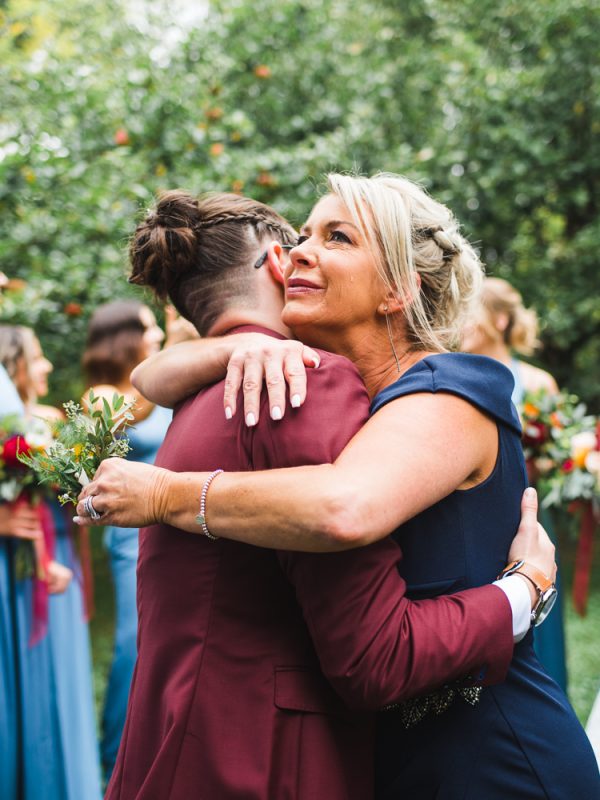 Mother hugging her daughter on her wedding day