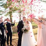 Rose Petals thrown in air over couple on wedding day